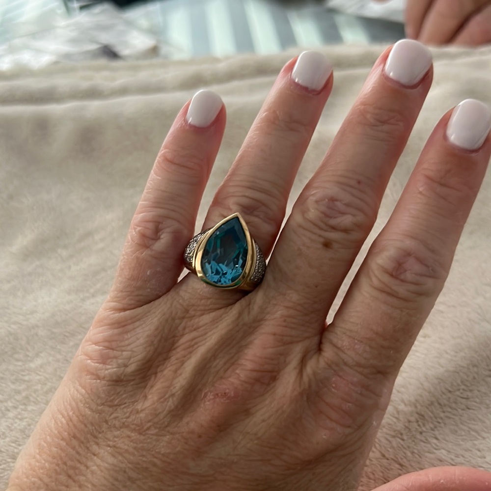 Blue Topaz 14KT gold stunning ring with diamonds